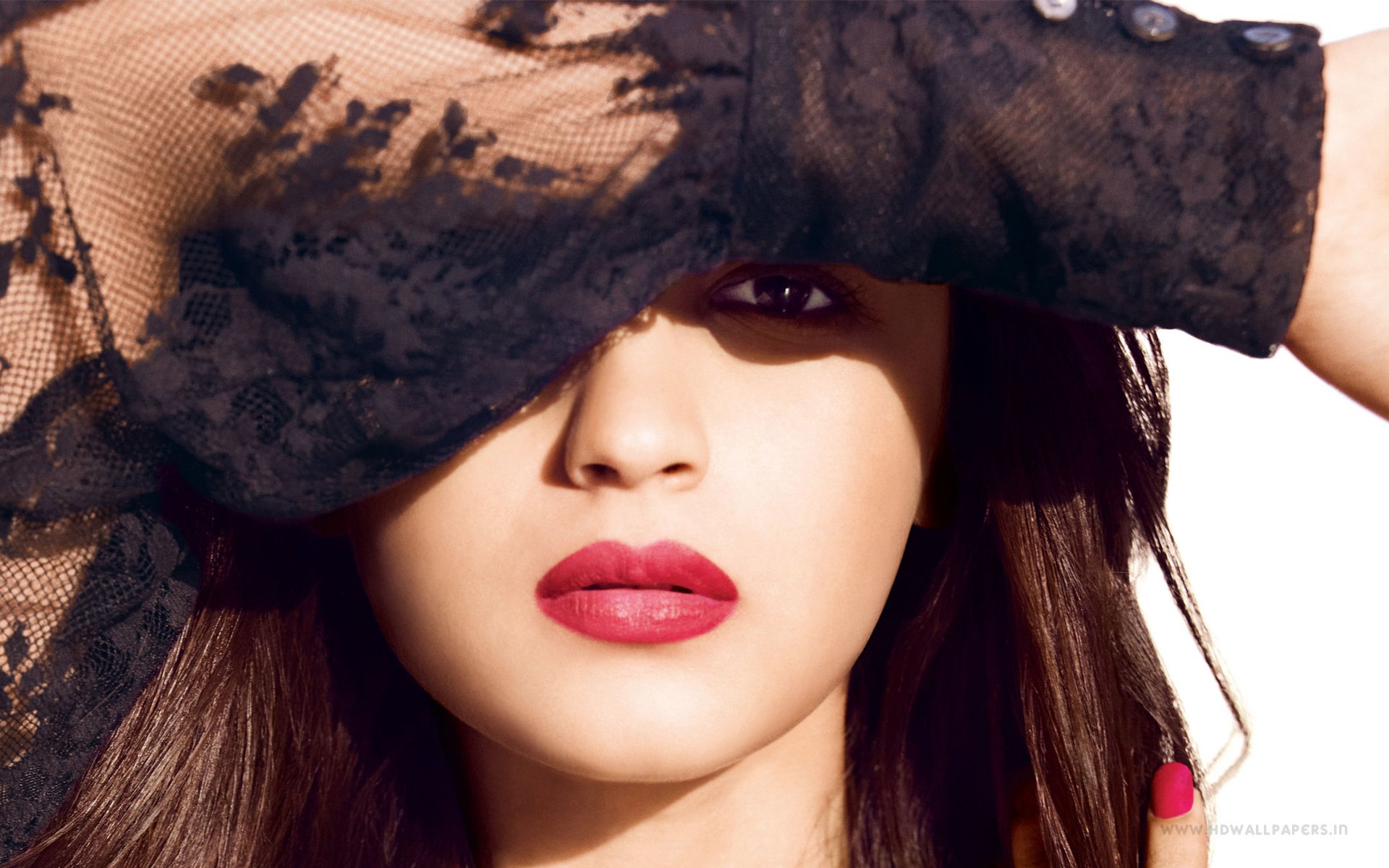 HD PC desktop wallpaper: glamorous close-up of a woman with bold red lipstick and a sheer lace sleeve partly shielding her eyes.