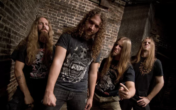 HD desktop wallpaper featuring the band Lazarus A.D. posing confidently against a brick wall background.