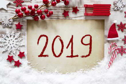 Holiday New Year 2019 5K Ultra HD PC desktop wallpaper and background: red 2019 on parchment surrounded by snow, red berries, stars, snowflakes, candy canes and a tiny Santa hat.