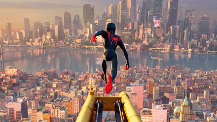 Miles Morales as Spider-Man overlooks the vibrant New York City skyline in an HD desktop wallpaper from the movie Spider-Man: Into The Spider-Verse.