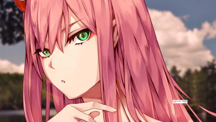 HD desktop wallpaper featuring Zero Two from Darling in the FranXX with pink hair and green eyes, set against a blurred natural background.