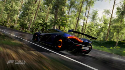Rear three-quarter view of a black McLaren P1 speeding down a sunlit forest road — Forza Horizon 3 video game HD PC desktop wallpaper/background