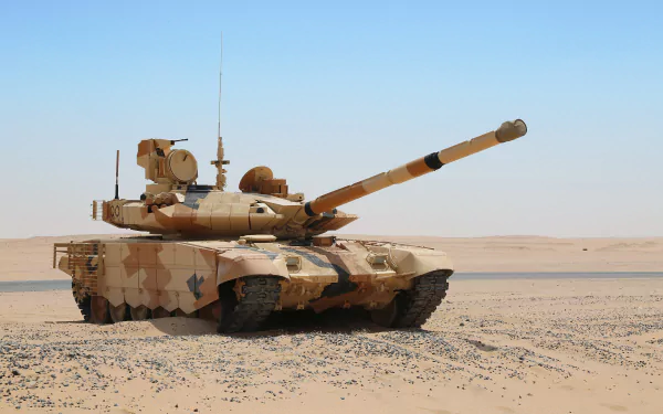 HD desktop wallpaper featuring a military T-90 tank camouflaged in desert terrain under a clear blue sky.