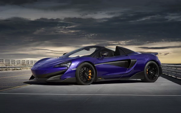 5K Ultra HD PC desktop wallpaper: purple McLaren 600LT supercar parked on a rooftop under a dramatic sky — sleek McLaren sports car vehicle background.