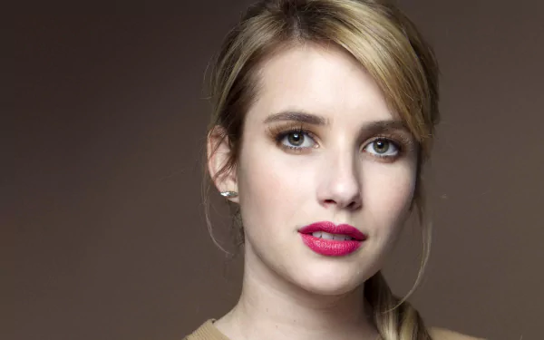 HD desktop wallpaper featuring a close-up portrait of celebrity Emma Roberts with natural makeup and a neutral background.
