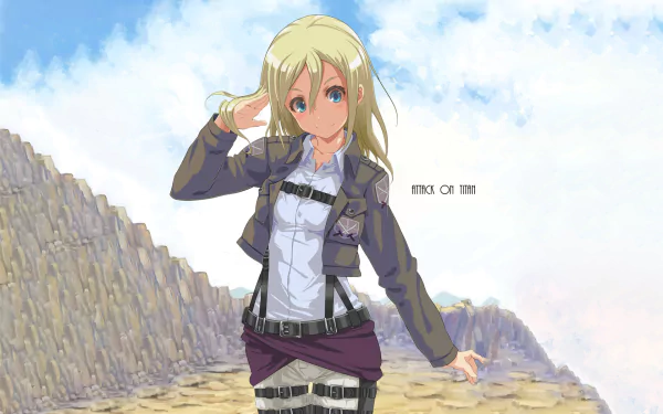 HD desktop wallpaper featuring Historia Reiss from the anime Attack on Titan, standing on rocky terrain under a bright blue sky.