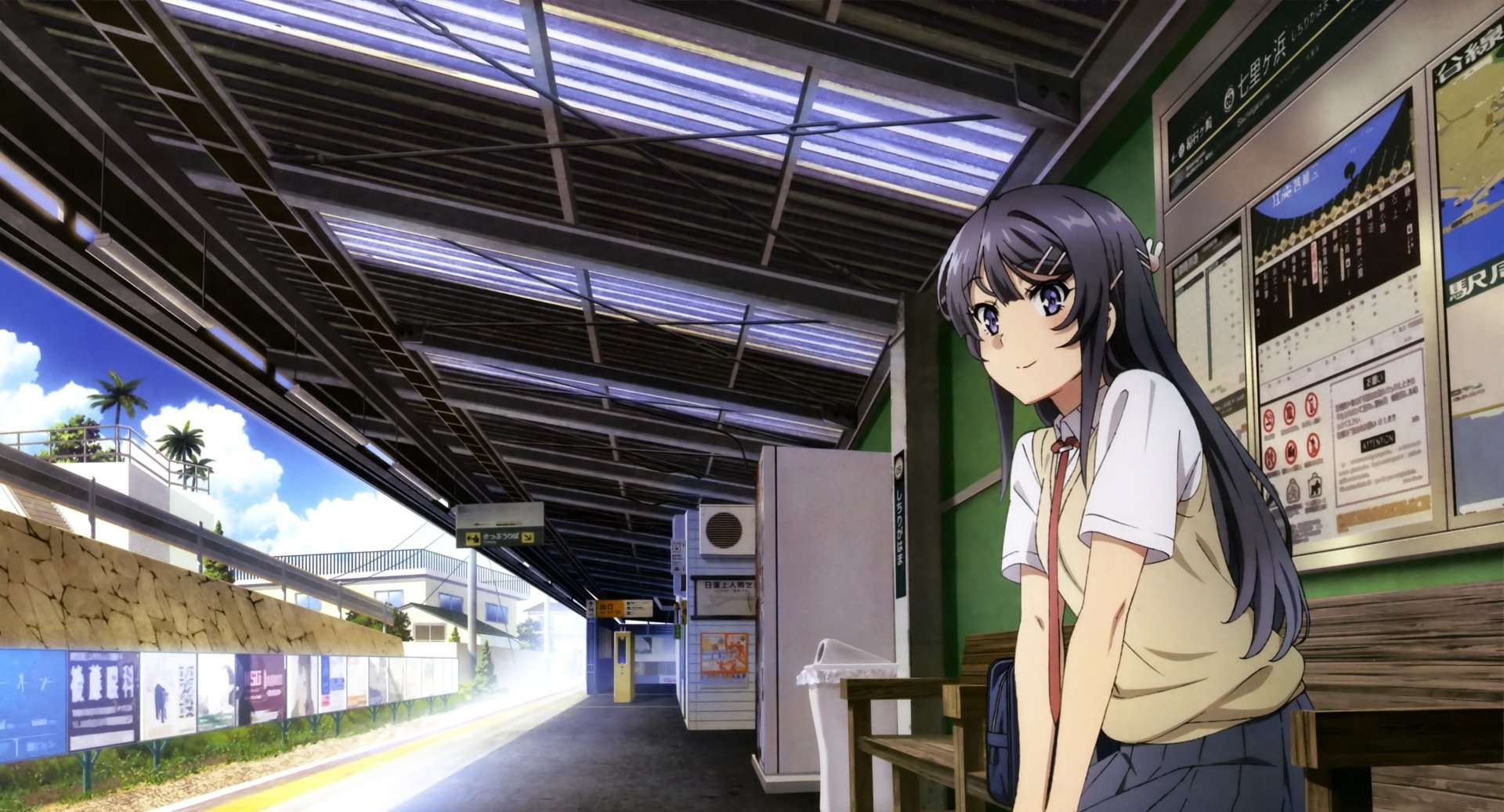 Anime character Mai Sakurajima from Rascal Does Not Dream of Bunny Girl Senpai at a train station. This HD desktop wallpaper captures her in a thoughtful pose surrounded by a brightly lit setting.
