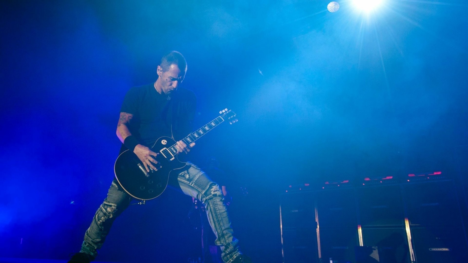 Godsmack guitarist performing on stage, with vivid lighting, as a high-definition desktop wallpaper and background.